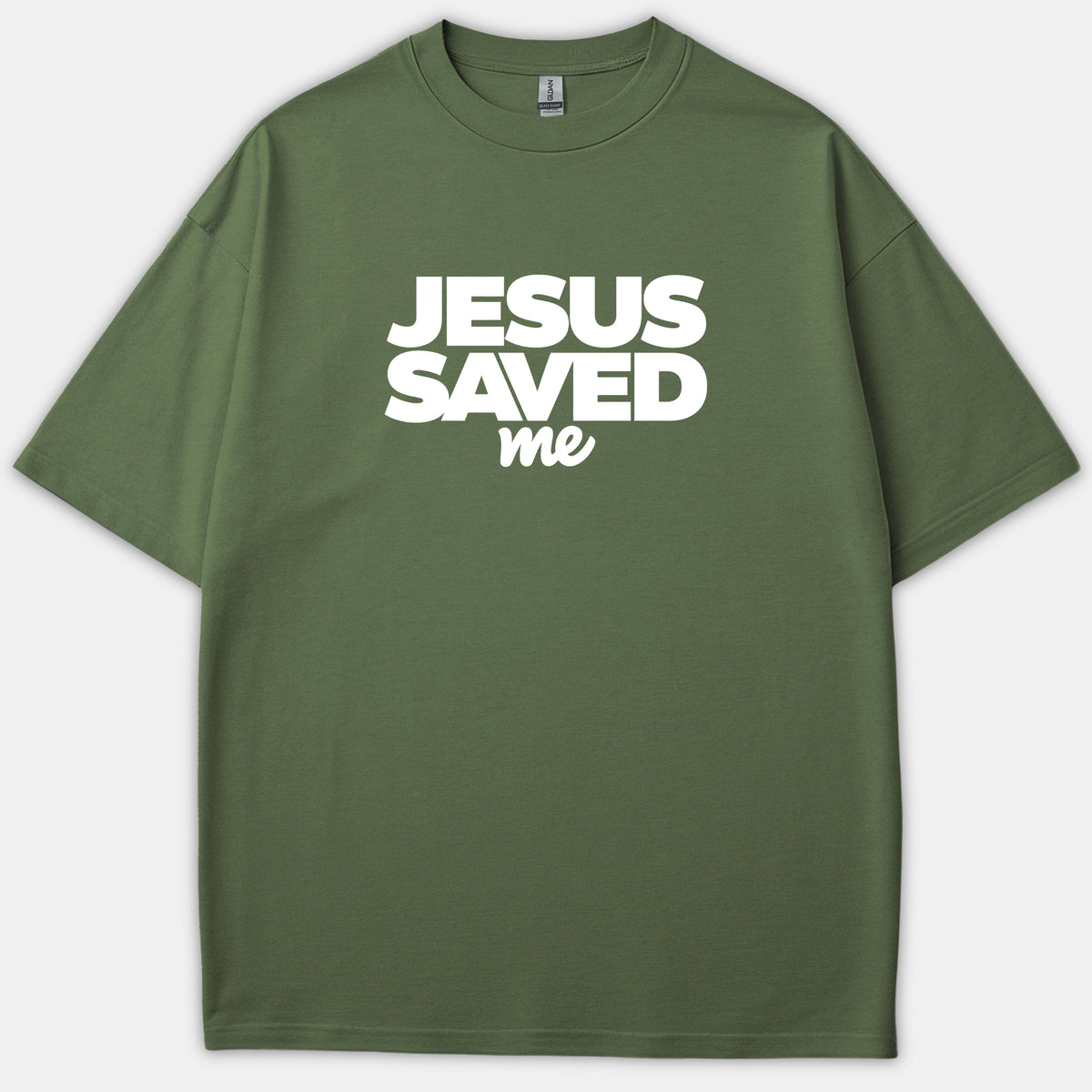An olive green Christian T-shirt featuring the phrase 'JESUS SAVED me' printed in bold white typography across the chest.