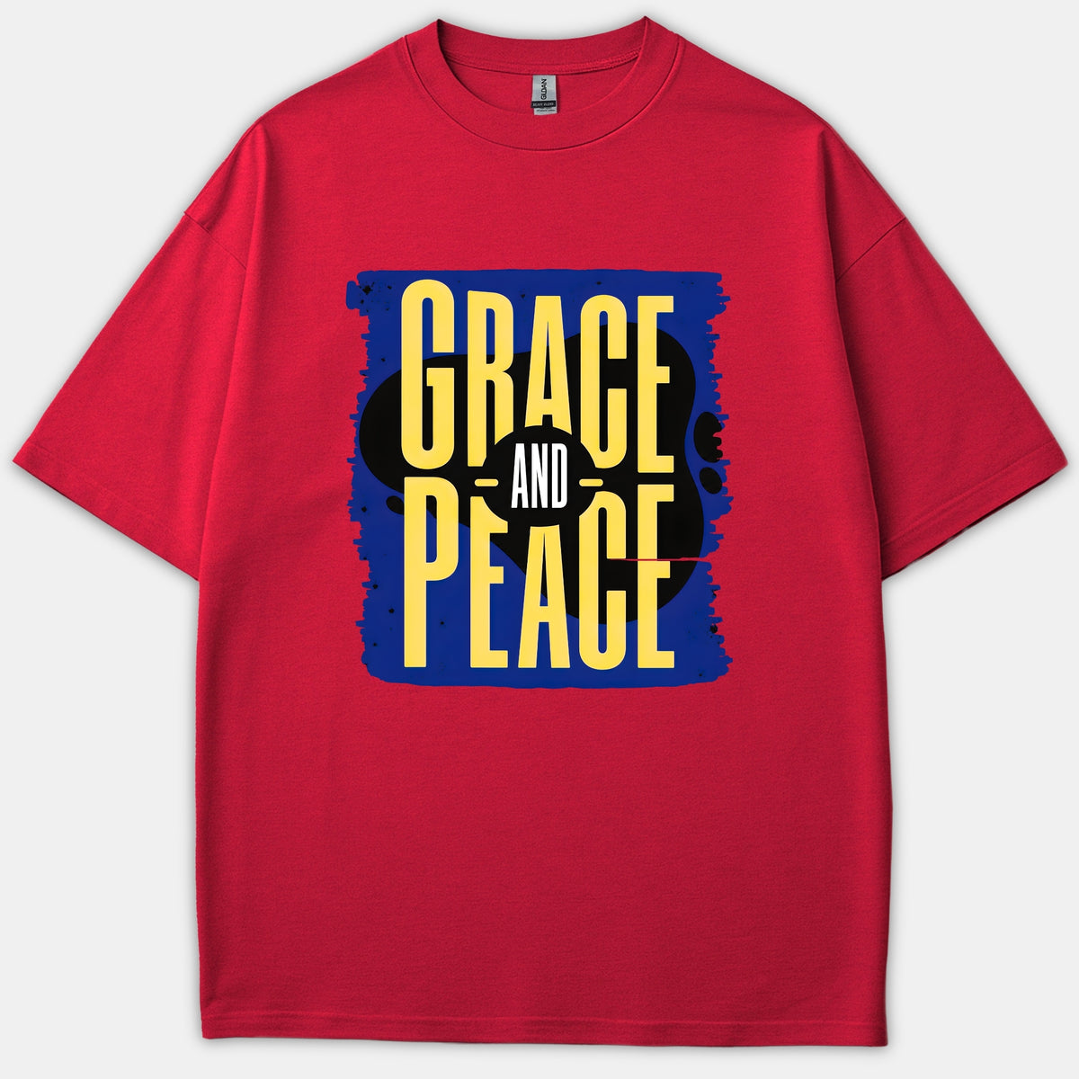 A red t-shirt featuring a bold blue graphic with yellow typography that reads Grace and Peace.