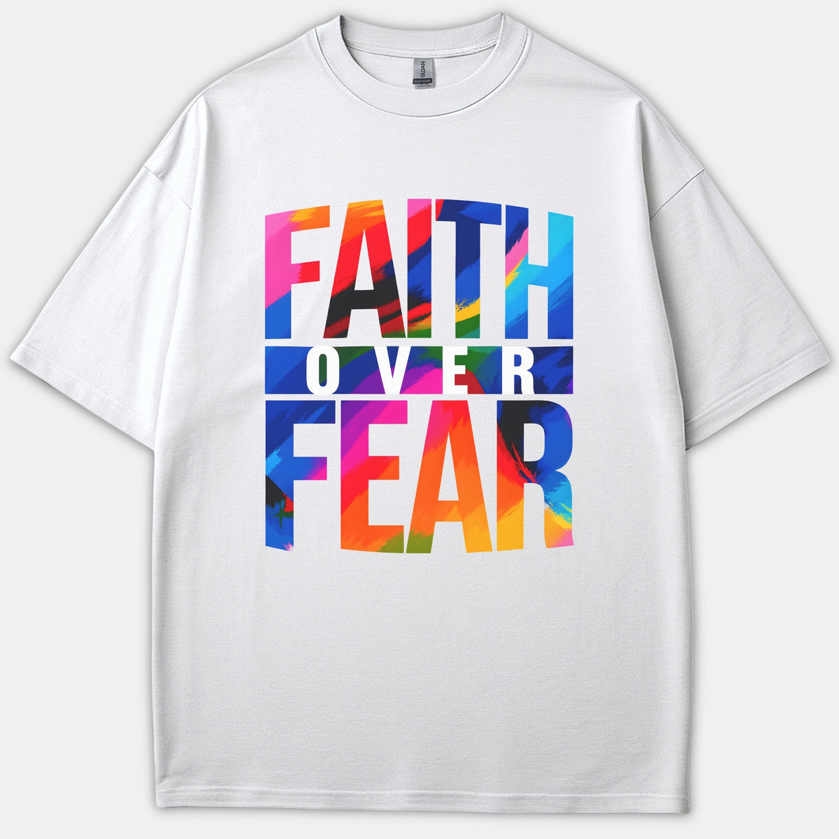 A white Christian t-shirt featuring a vibrant, multicolored brushstroke graphic design that reads FAITH OVER FEAR across the front.