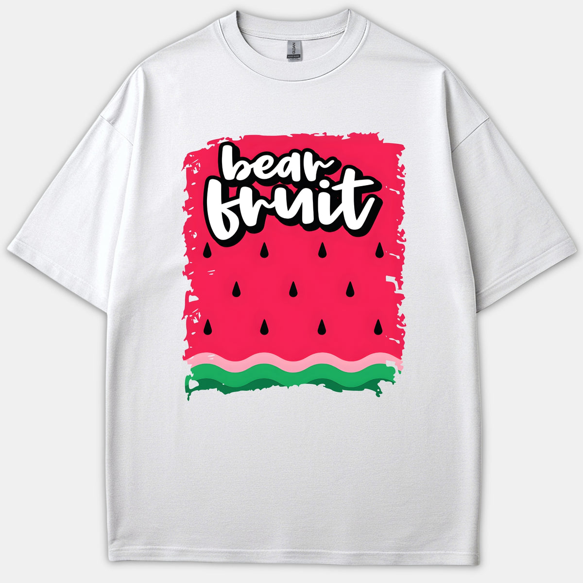 A white T-shirt featuring a vibrant watermelon graphic pattern with the words 'bear fruit' written in bold white typography.