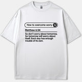 A white Christian T-shirt featuring a search bar graphic reading How to Overcome Worry above the scripture text for Matthew 6:34 in bold black print.