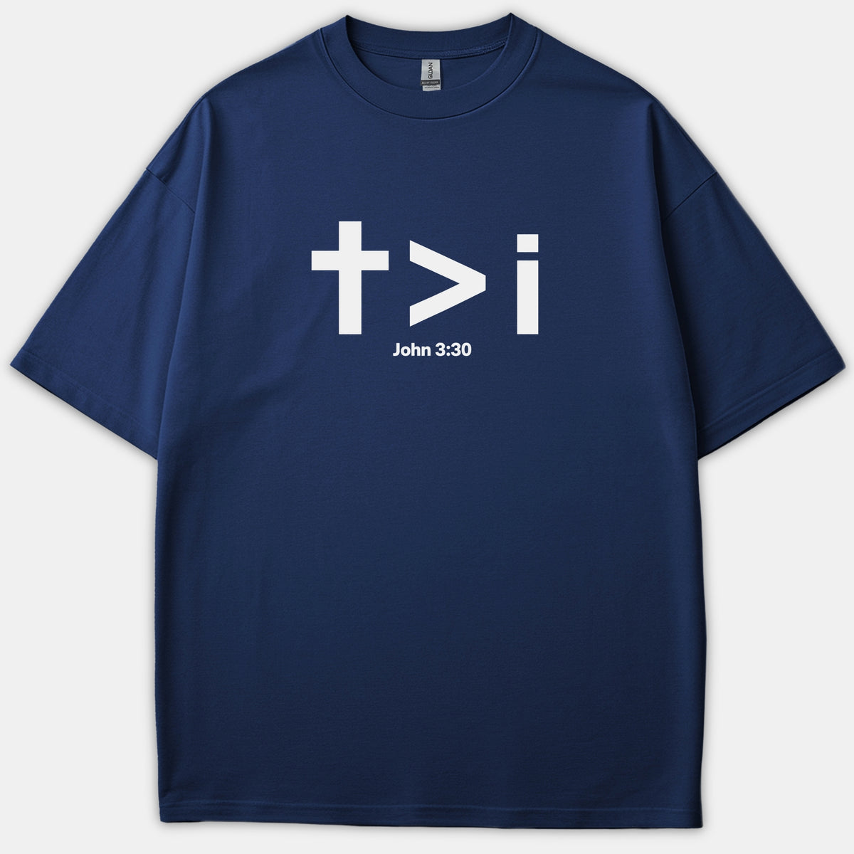 A navy blue Christian t-shirt featuring a bold white graphic displaying a cross, a greater-than symbol, the letter i, and the scripture reference John 3:30.
