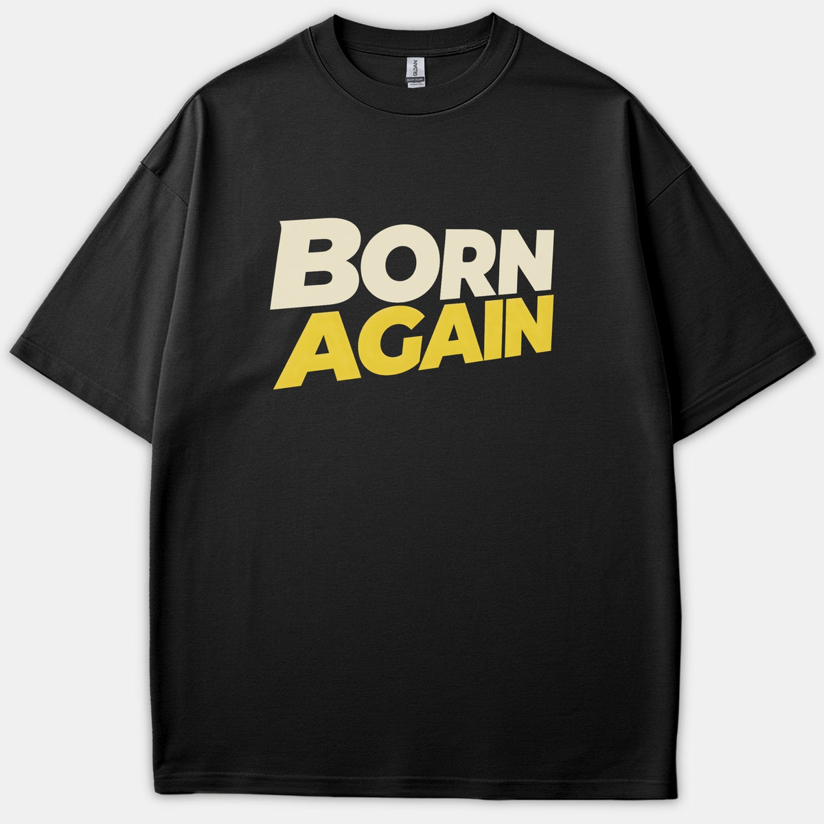 A black t-shirt featuring bold block text across the chest that reads BORN AGAIN in beige and yellow lettering.