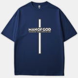 A navy blue t-shirt featuring a tall Christian cross graphic with the words MAN OF GOD HUSBAND DAD PROTECTOR printed in white across the center.
