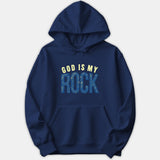 A navy blue hoodie featuring a Christian graphic print reading GOD IS MY ROCK in pale yellow and distressed blue text across the chest.