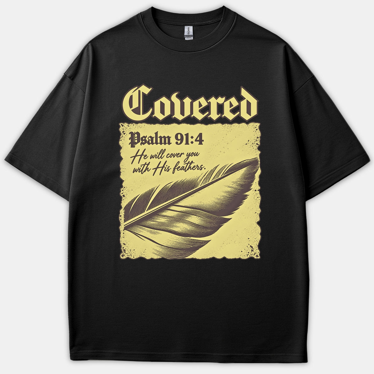 A black t-shirt featuring a vintage graphic with the text Covered Psalm 91:4 He will cover you with His feathers alongside a detailed feather illustration.