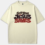 A beige Christian t-shirt featuring a bold graphic print reading Good News Jesus Saves in stylized black and red lettering.