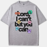 A gray t-shirt featuring the bold black graphic phrase 'Lord, I can't but you can' surrounded by pastel shapes with Bible verse references.