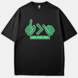 A black t-shirt featuring a green graphic with hand symbols displaying a greater-than sign above the text GOD OVER SELF.