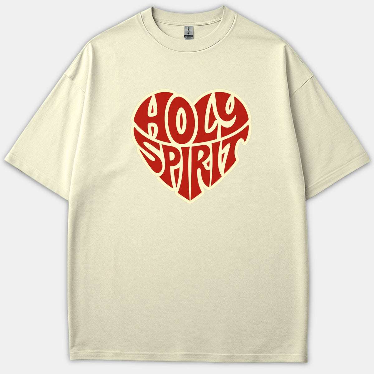 A beige Christian t-shirt featuring a red heart-shaped graphic with the words Holy Spirit written in bold, retro typography.