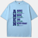 A light blue t-shirt displaying a vertical AMEN acronym graphic that reads Agree With God, Move With God, End With God, and Never Doubt God in navy and green text.