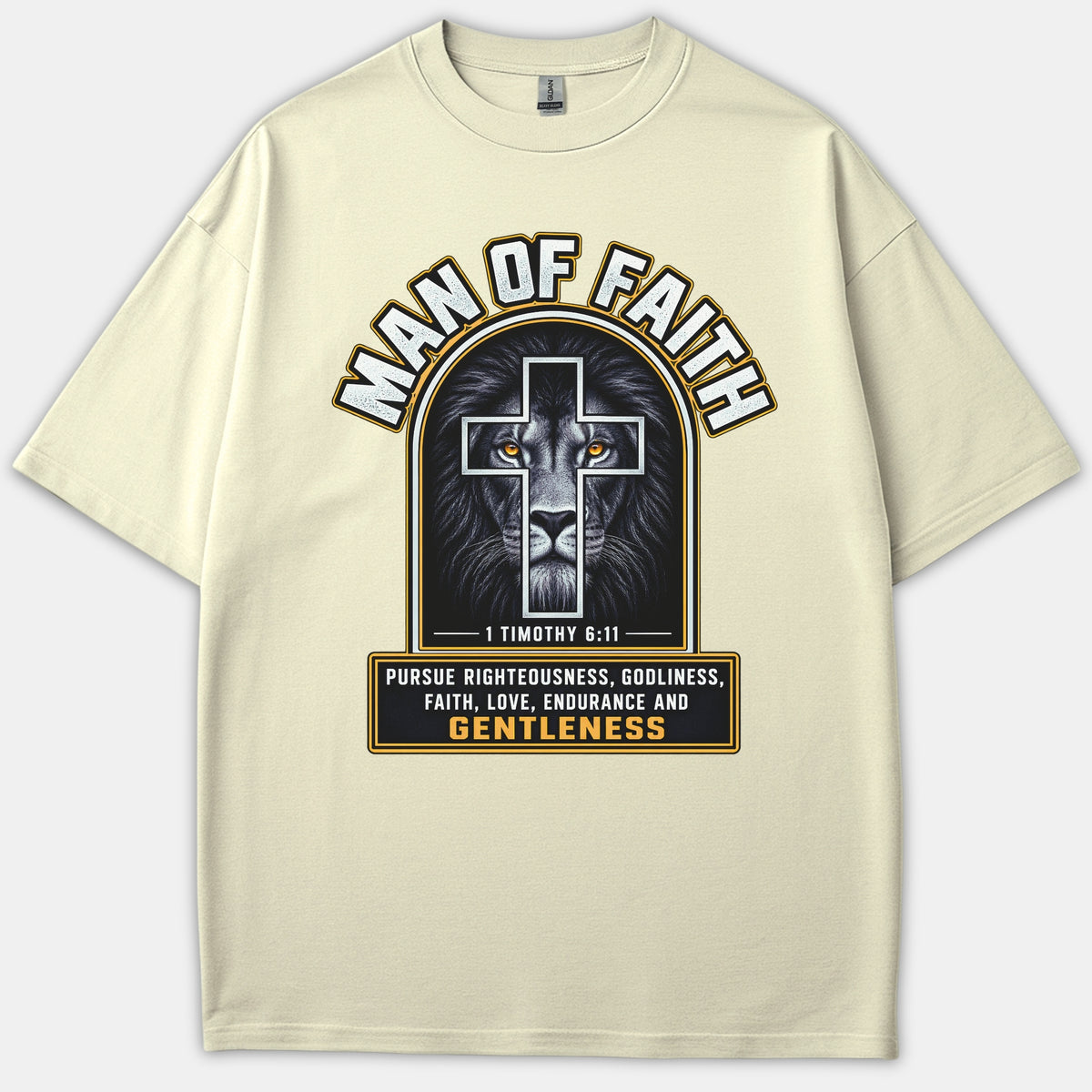 A beige Christian t-shirt featuring a graphic of a lion behind a cross with the words Man of Faith and 1 Timothy 6:11 scripture.