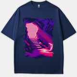 A navy blue T-shirt featuring a retro synthwave-style graphic of a dark cave with stairs leading up toward a bright pink and white glowing entrance.