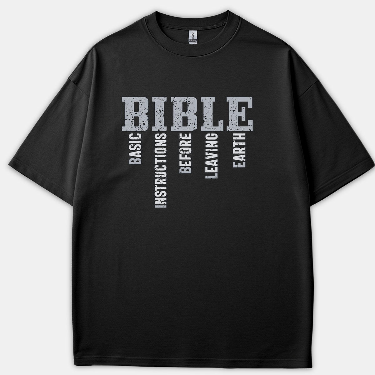 A black t-shirt featuring a distressed vintage graphic that spells out BIBLE alongside the acrostic Basic Instructions Before Leaving Earth.