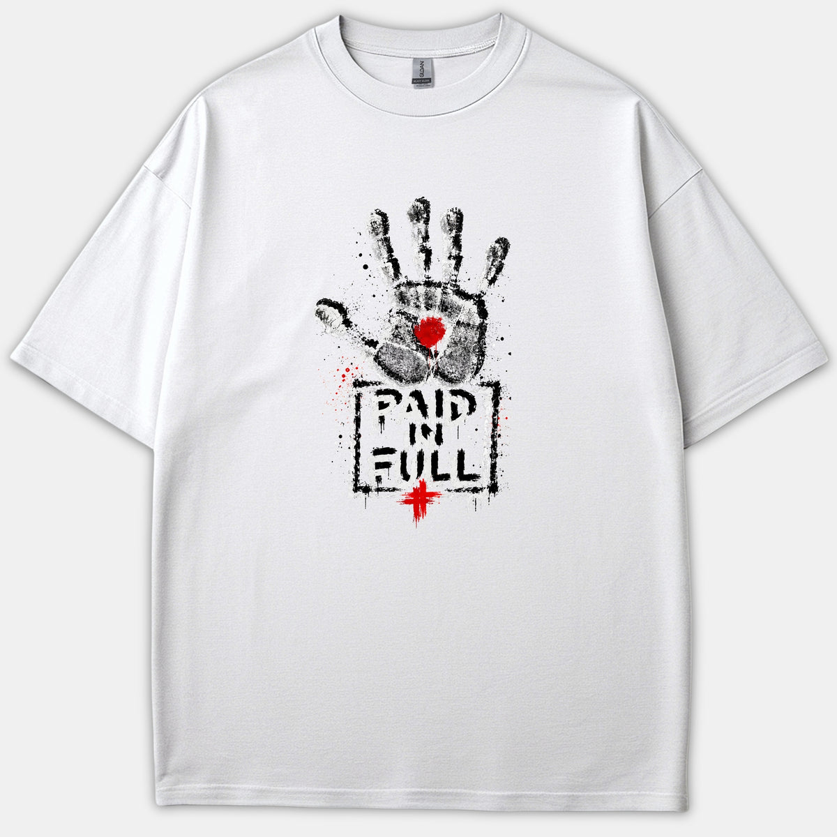 A white Christian T-shirt featuring a distressed black handprint with a red mark on the palm above the words PAID IN FULL and a small red cross.