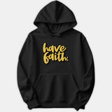 A black hoodie featuring yellow cursive script text on the chest that reads 'have faith.'