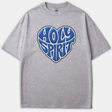 A heather gray t-shirt featuring a heart-shaped graphic with the words HOLY SPIRIT styled in bold blue typography.