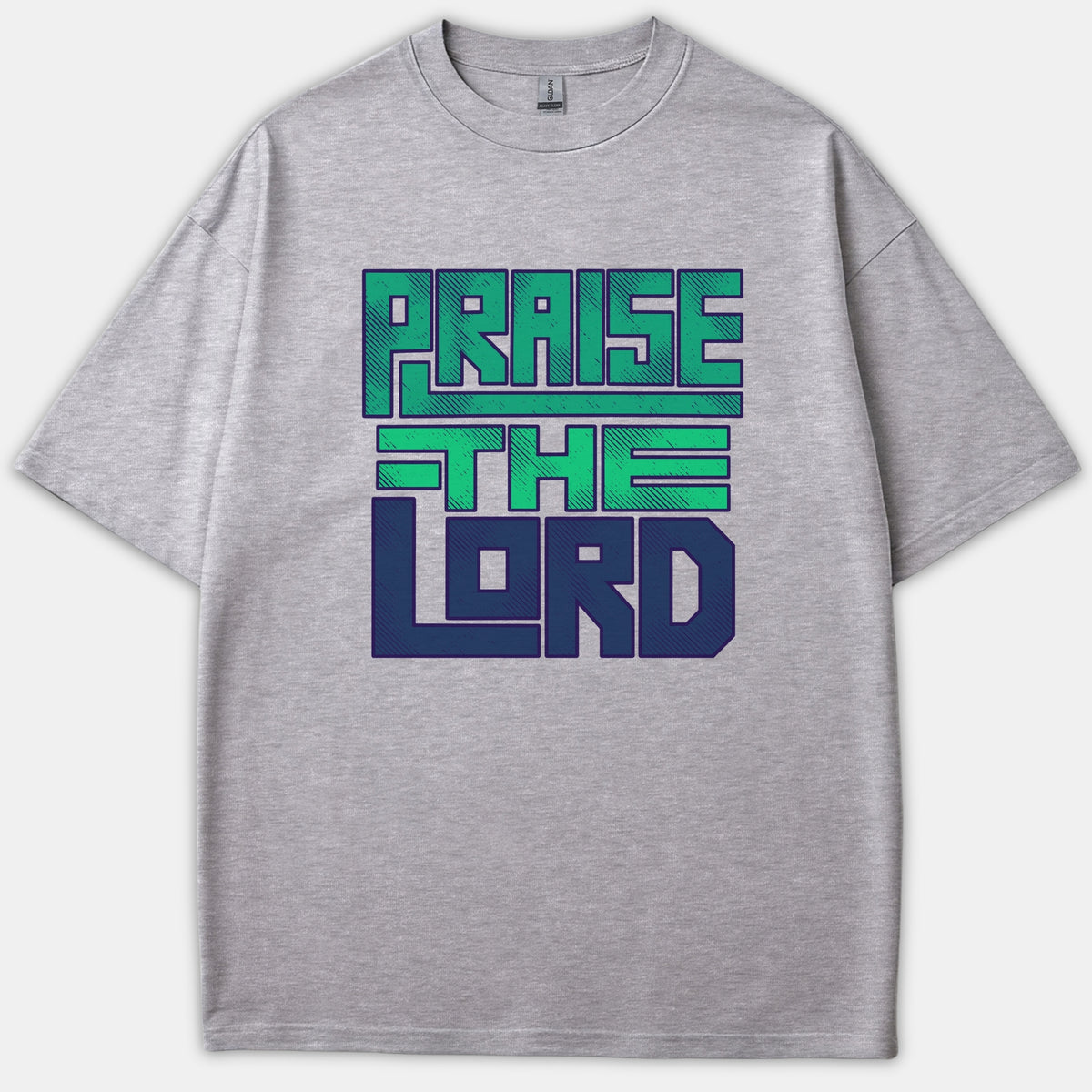 A heather gray Christian t-shirt featuring bold, block typography that reads PRAISE THE LORD in teal green and navy blue graphics across the front.