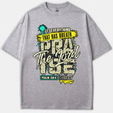 Gray Christian t-shirt featuring a graffiti-style graphic print that reads 'Let Everything That Has Breath Praise The Lord' with Psalm 150:6 scripture reference.