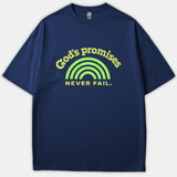A navy blue t-shirt featuring a light green rainbow arch graphic surrounded by the text 'God's promises NEVER FAIL' printed on the chest.