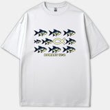 A white Christian T-shirt featuring a graphic of blue fish swimming to the right with a yellow Christian fish symbol swimming left, above the text ROMANS 12:2.