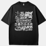 A black T-shirt featuring a detailed Christian graphic titled New Testament surrounded by biblical illustrations depicting Christ's life, crucifixion, and resurrection timeline.