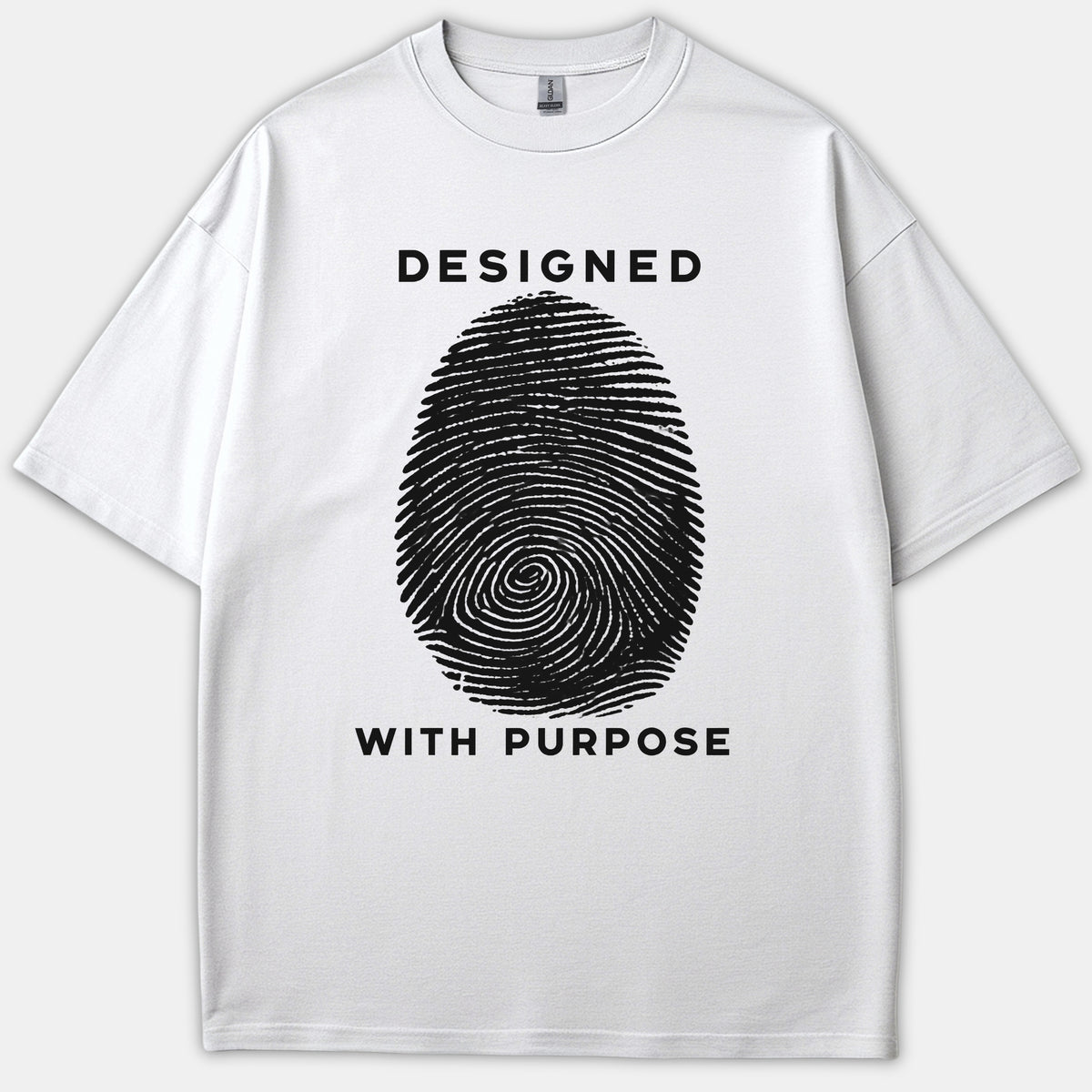 A white graphic t-shirt featuring a large black fingerprint illustration with the phrase DESIGNED WITH PURPOSE printed in bold letters.
