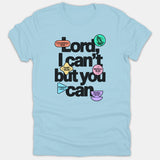 A light blue T-shirt featuring the Christian phrase 'Lord, I can't but you can' written in bold black typography with colorful Bible verse icons.