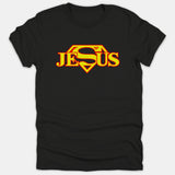A black t-shirt featuring the word JESUS rendered in yellow and red inside a superhero diamond emblem across the chest.