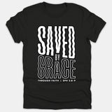 A black Christian t-shirt featuring wavy white typography that reads 'Saved By Grace Through Faith' with the Bible scripture reference 'Eph 2:8-9' printed below.