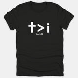 A black Christian T-shirt featuring a white cross, a greater-than symbol, a lowercase i, and the Scripture reference John 3:30.