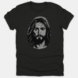 A black t-shirt featuring a detailed artistic portrait of Jesus Christ designed within a fingerprint pattern.