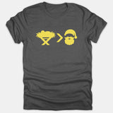 A dark gray t-shirt featuring a yellow graphic displaying a baby in a manger, a greater-than symbol, and Santa Claus.
