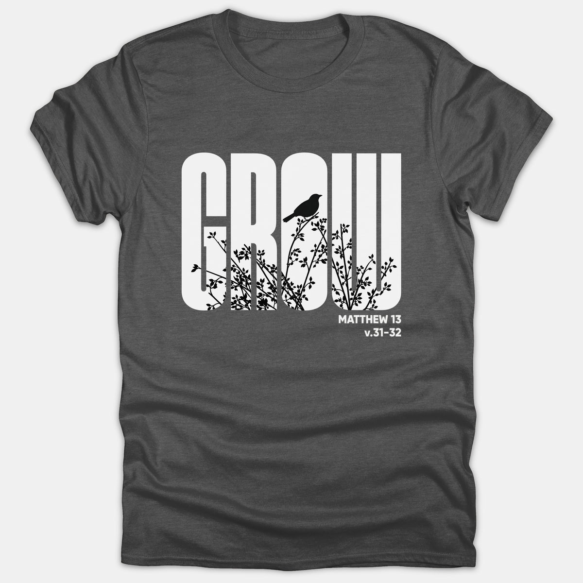 Dark gray Christian t-shirt featuring the word GROW in bold white text filled with black tree branch and bird silhouettes, referencing Matthew 13 v.31-32.