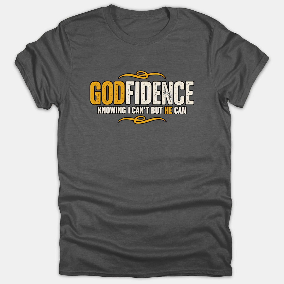 A dark gray t-shirt featuring the inspirational Christian text 'Godfidence Knowing I Can't But He Can' printed in gold and white with decorative swirl accents.