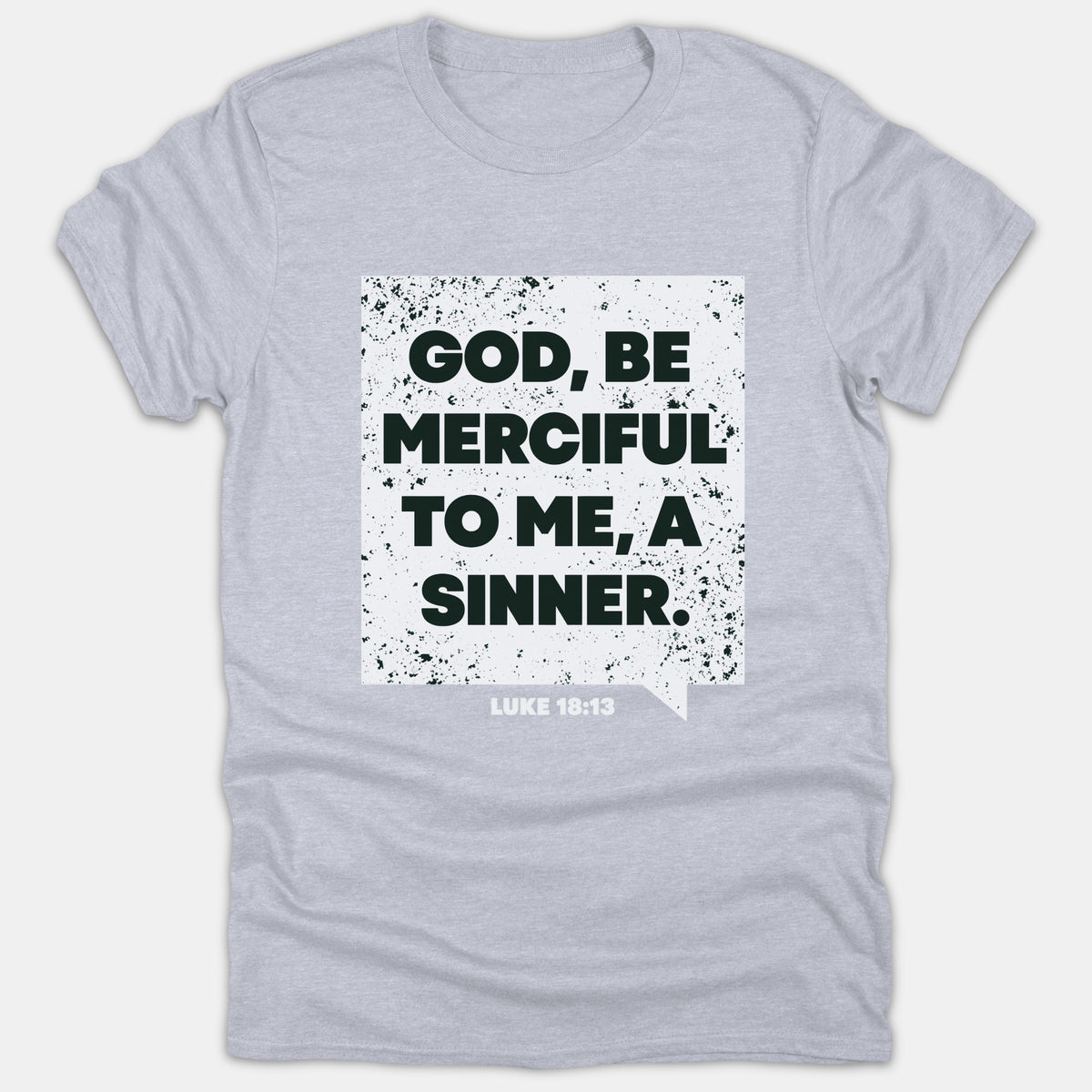 A light gray Christian t-shirt featuring a distressed white box graphic with bold black text reading 'GOD, BE MERCIFUL TO ME, A SINNER.' above Luke 18:13.