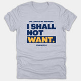 A heather gray graphic t-shirt featuring the biblical text 'The Lord is my shepherd. I shall not want. Psalm 23:1' printed in navy blue and yellow block lettering.