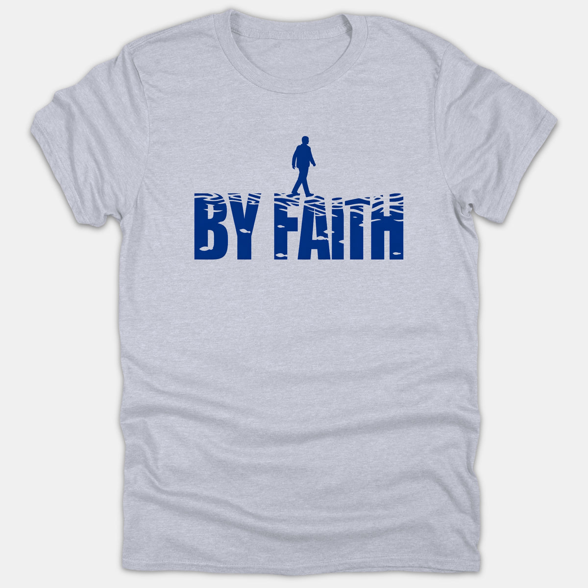 A light gray t-shirt featuring a blue graphic with the text BY FAITH and a silhouette of a person walking on water across the letters.