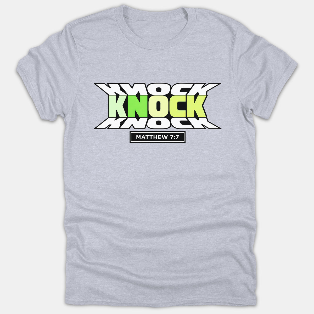 A light gray T-shirt featuring a stylized graphic with the word Knock stacked three times in green gradient and white, above the Bible verse reference Matthew 7:7.