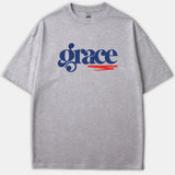 A heather gray t-shirt featuring the word grace printed in a stylized navy blue font with a red brushstroke accent underneath.