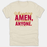 A beige Christian t-shirt featuring the text 'Whispering AMEN, not waking ANYONE.' printed in red and gold script and block lettering.