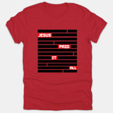 A red Christian t-shirt featuring a black redacted bar graphic with the phrase 'Jesus Paid It All' highlighted in white text inside red boxes.