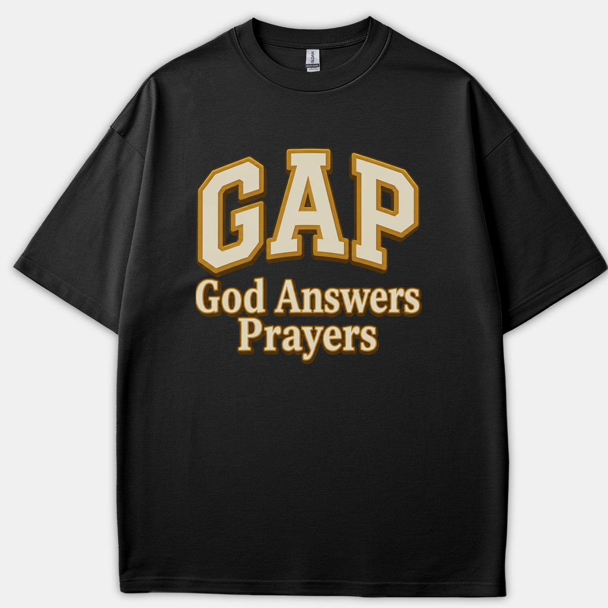 A black t-shirt featuring the letters GAP in collegiate arch text above the phrase God Answers Prayers printed in beige and gold.
