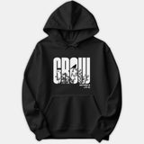 A black hoodie featuring a graphic print of the word GROW with botanical and bird silhouettes inside the letters, alongside the scripture reference Matthew 13 v.31-32.