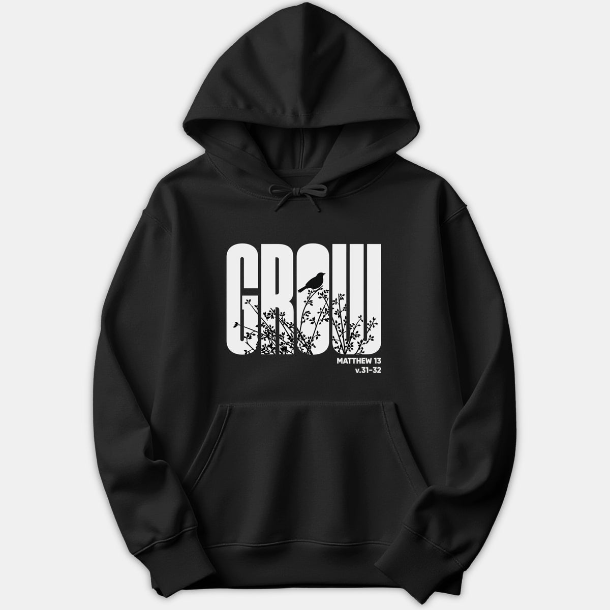 A black hoodie featuring a graphic print of the word GROW with botanical and bird silhouettes inside the letters, alongside the scripture reference Matthew 13 v.31-32.