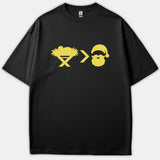 A black Christian t-shirt with a yellow graphic featuring a baby in a manger, a greater-than symbol, and Santa Claus.