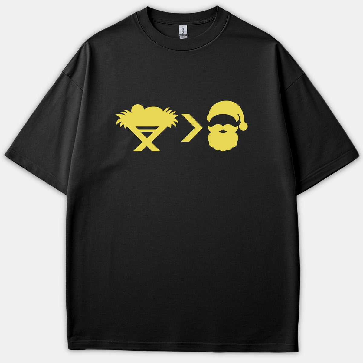 A black Christian t-shirt with a yellow graphic featuring a baby in a manger, a greater-than symbol, and Santa Claus.
