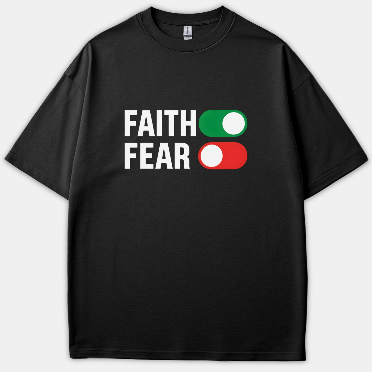 A black Christian t-shirt featuring the words FAITH and FEAR next to toggle icons, showing faith switched on in green and fear switched off in red.