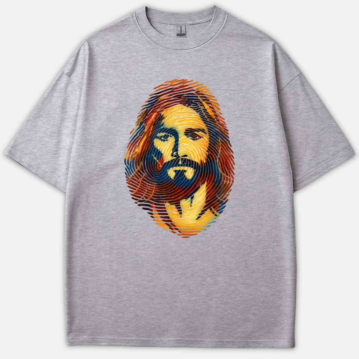 A gray t-shirt featuring a colorful graphic portrait of Jesus Christ stylized in the shape of a fingerprint using orange, yellow, and blue tones.