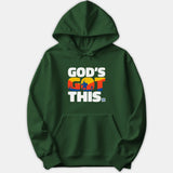 A dark green hoodie featuring bold white text that reads God's Got This with a colorful sunset scene depicting David and Goliath inside the middle letters.